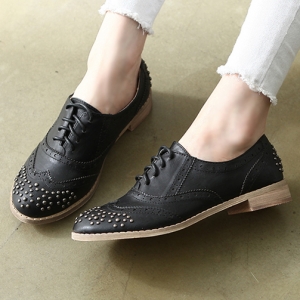 https://what-is-fashion.com/3483-26725-thickbox/womens-rock-chic-front-back-stud-wing-tip-punching-black-synthetic-leather-lace-up-flat-oxfords-fashion-shoes.jpg